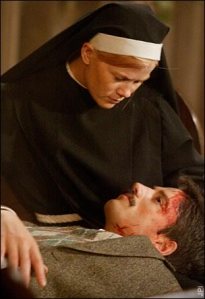 Sister Colleen ministers to an injured Santo